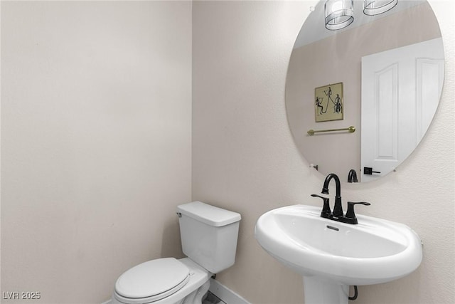 24 Staghorn St, Henderson, NV 89012 - half bathroom featuring a sink and toilet