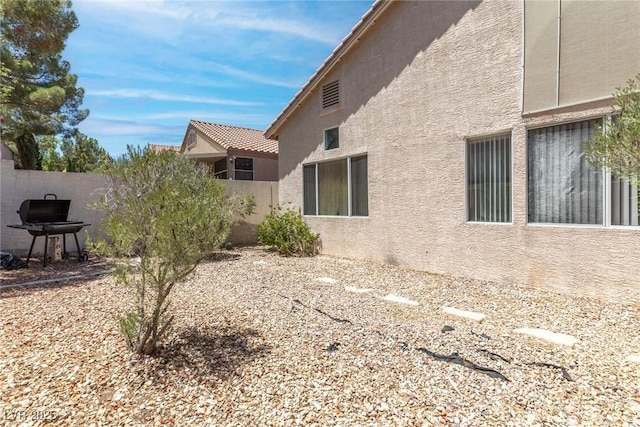 24 Staghorn St, Henderson, NV 89012 - view of side of home with stucco siding