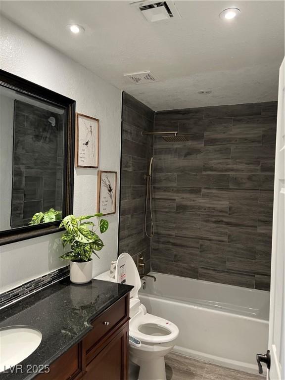 7247 Manatee Ct, Las Vegas, NV 89147 - bathroom with vanity, bathtub / shower combination, and recessed lighting