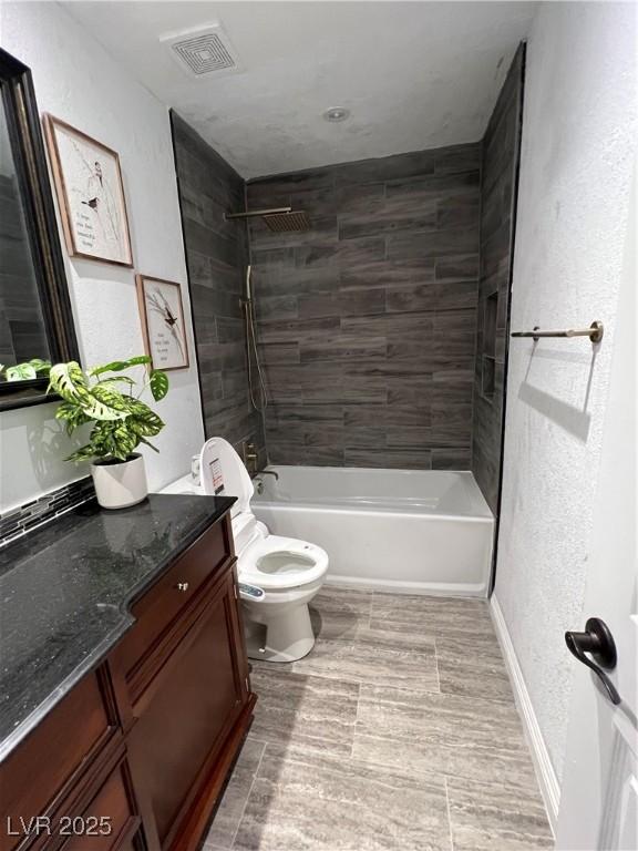 7247 Manatee Ct, Las Vegas, NV 89147 - full bathroom with vanity, tub / shower combination, and a textured wall