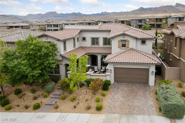 367 Pollino Peaks St, Las Vegas, NV 89138 - mediterranean / spanish home with stucco siding, a residential view, a garage, and decorative driveway