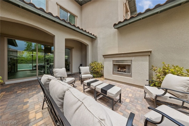 367 Pollino Peaks St, Las Vegas, NV 89138 - view of patio featuring an outdoor living space with a fireplace