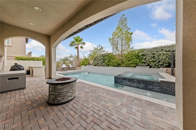 367 Pollino Peaks St, Las Vegas, NV 89138 - view of patio featuring a fire pit and a pool with connected hot tub