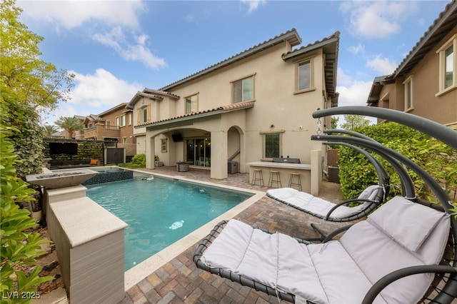 367 Pollino Peaks St, Las Vegas, NV 89138 - rear view of house with stucco siding, a patio, and a tile roof