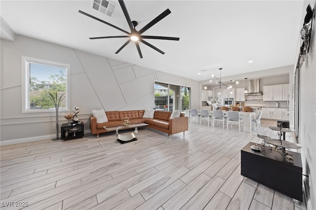 367 Pollino Peaks St, Las Vegas, NV 89138 - living room featuring light wood-style flooring, a ceiling fan, and recessed lighting