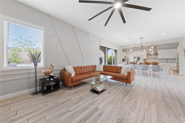 367 Pollino Peaks St, Las Vegas, NV 89138 - living area featuring light wood-style flooring, ceiling fan, and a chandelier