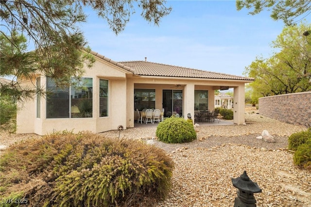 4126 Cascada Piazza Ln, Las Vegas, NV 89135 - rear view of property featuring a ceiling fan, stucco siding, a patio area, and a tiled roof