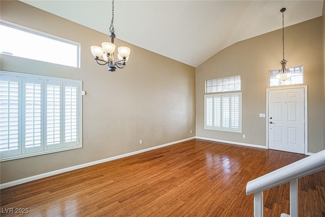 10204 Waseca Ave, Las Vegas, NV 89144 - foyer entrance featuring a chandelier, healthy amount of natural light, wood finished floors, and high vaulted ceiling