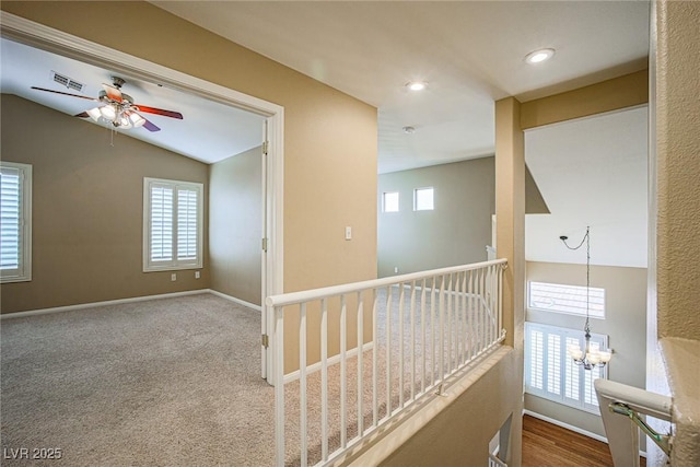 10204 Waseca Ave, Las Vegas, NV 89144 - corridor with healthy amount of natural light, vaulted ceiling, a chandelier, and recessed lighting