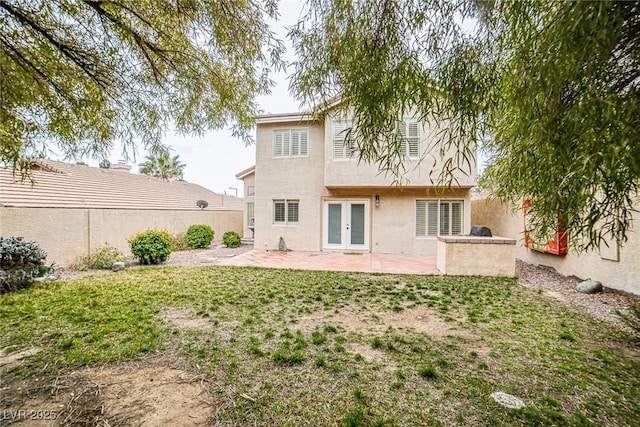 10204 Waseca Ave, Las Vegas, NV 89144 - rear view of property featuring french doors, a patio area, a fenced backyard, and stucco siding