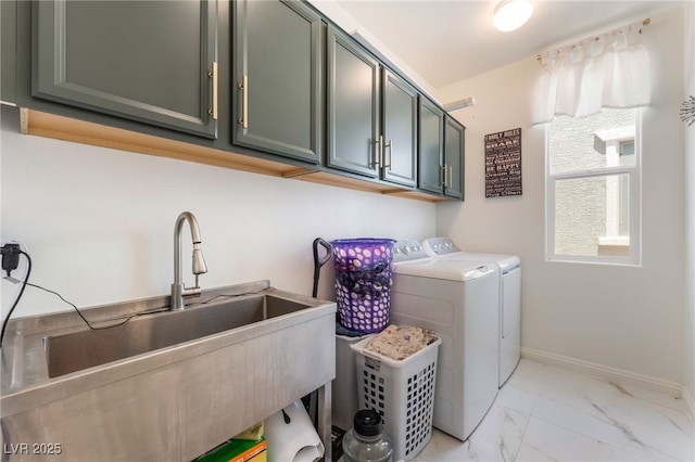 6209 Gambetta St, Las Vegas, NV 89115 - laundry room with cabinet space, washer and clothes dryer, and light marble finish flooring