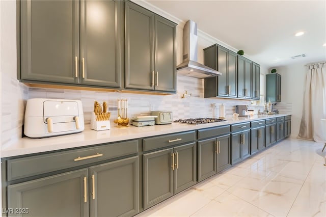 6209 Gambetta St, Las Vegas, NV 89115 - kitchen with wall chimney range hood, stainless steel gas stovetop, backsplash, light marble finish flooring, and recessed lighting