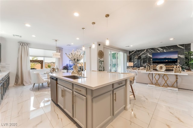 6209 Gambetta St, Las Vegas, NV 89115 - kitchen with light marble finish floors, stainless steel dishwasher, gray cabinets, and recessed lighting