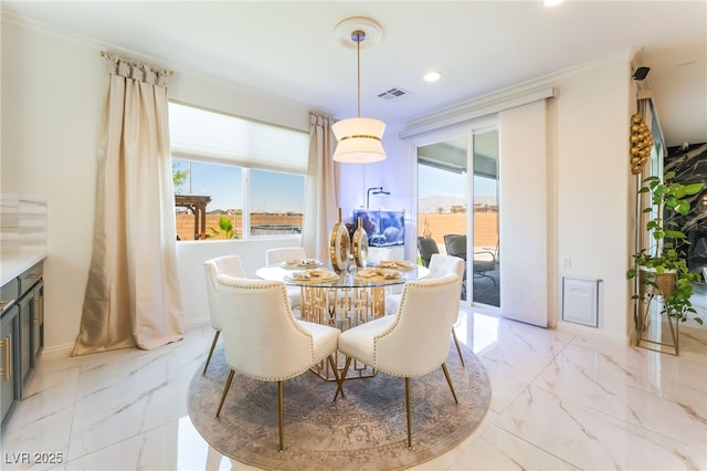 6209 Gambetta St, Las Vegas, NV 89115 - dining room with light marble finish floors, recessed lighting, and ornamental molding