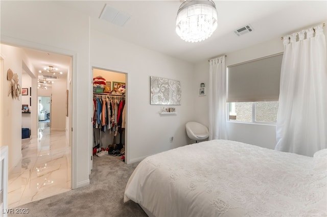 6209 Gambetta St, Las Vegas, NV 89115 - carpeted bedroom featuring a chandelier, a spacious closet, and a closet