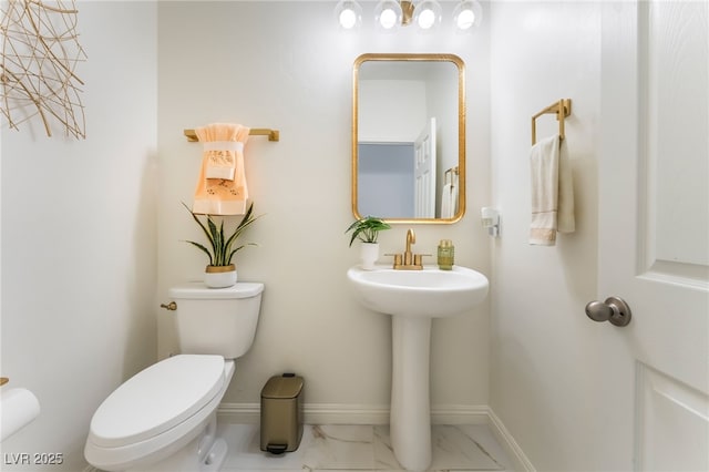 6209 Gambetta St, Las Vegas, NV 89115 - half bathroom with toilet and marble finish floors