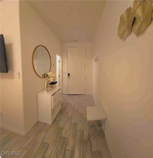 6209 Gambetta St, Las Vegas, NV 89115 - hall featuring light wood finished floors and vaulted ceiling