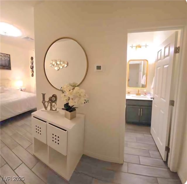 6209 Gambetta St, Las Vegas, NV 89115 - bedroom with a sink and ensuite bath