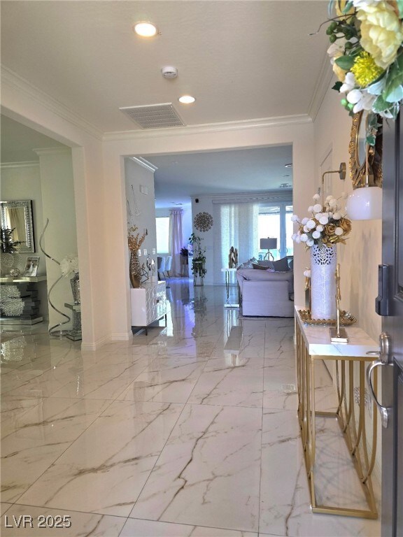 6209 Gambetta St, Las Vegas, NV 89115 - hallway with ornamental molding, healthy amount of natural light, recessed lighting, and marble finish flooring