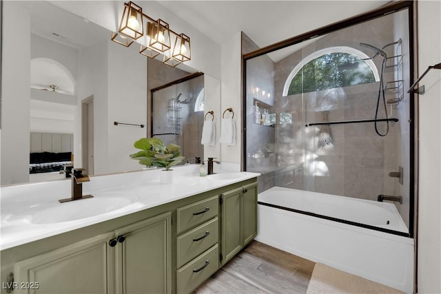 9089 Harvest Season Ct, Henderson, NV 89074 - bathroom featuring shower / bath combination with glass door, double vanity, and wood finished floors