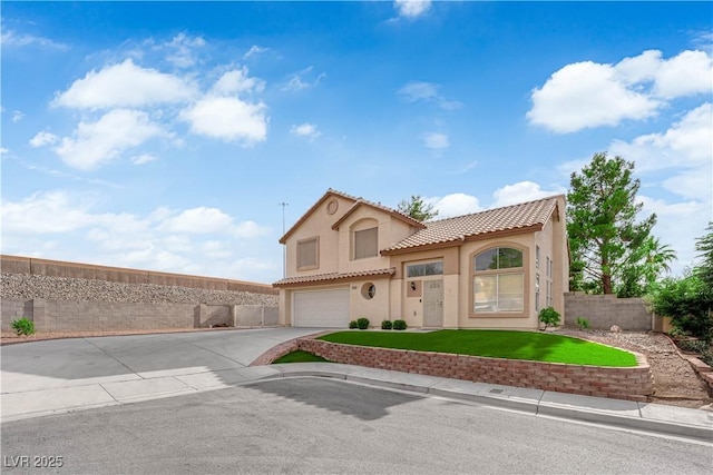 9089 Harvest Season Ct, Henderson, NV 89074 - mediterranean / spanish home featuring stucco siding, a tile roof, an attached garage, and driveway