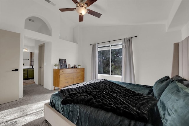 9089 Harvest Season Ct, Henderson, NV 89074 - bedroom with light carpet, lofted ceiling, and a ceiling fan
