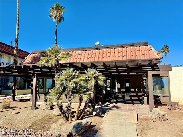 1405 Vegas Valley Dr Unit 347, Las Vegas, NV 89169 - rear view of property with a tile roof