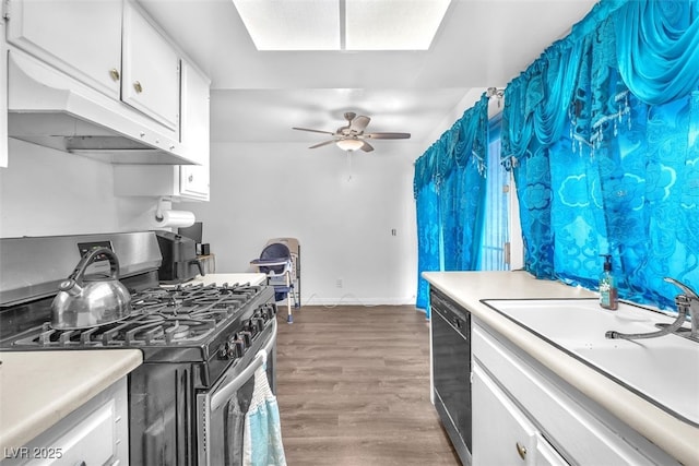 1405 Vegas Valley Dr Unit 347, Las Vegas, NV 89169 - kitchen featuring stainless steel range with gas stovetop, black dishwasher, light countertops, ceiling fan, and white cabinets