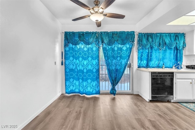 1405 Vegas Valley Dr Unit 347, Las Vegas, NV 89169 - spare room with wood finished floors, ceiling fan, and bar area