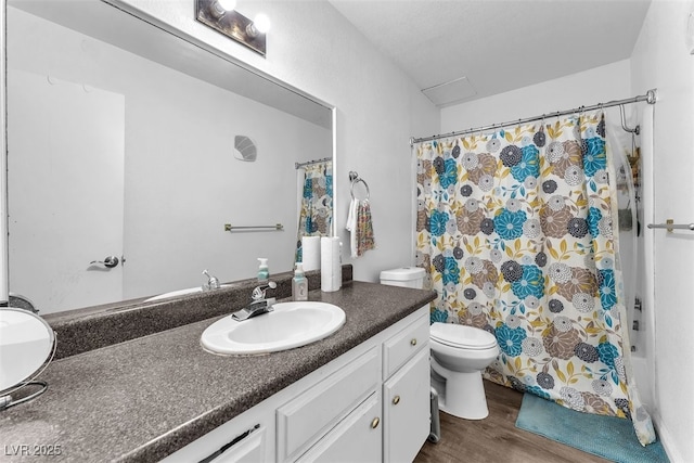 1405 Vegas Valley Dr Unit 347, Las Vegas, NV 89169 - bathroom featuring vanity, wood finished floors, and shower / bath combo