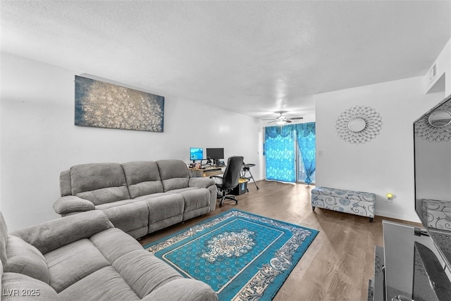 1405 Vegas Valley Dr Unit 347, Las Vegas, NV 89169 - living room featuring a textured ceiling, an office area, ceiling fan, and wood finished floors