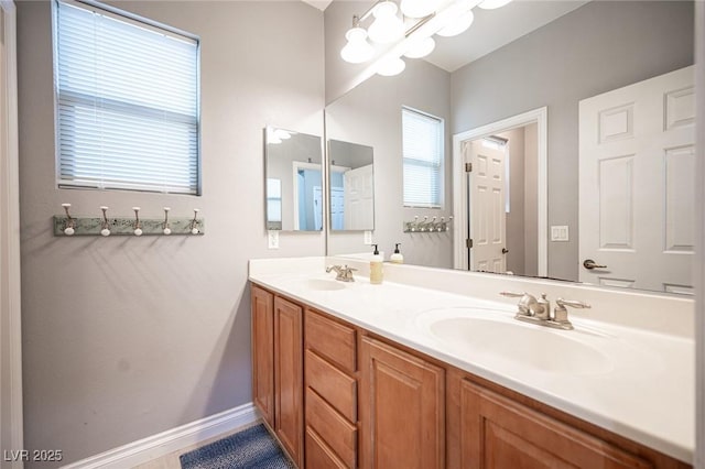 6937 Puetollano Dr, North Las Vegas, NV 89084 - bathroom with double vanity and a chandelier