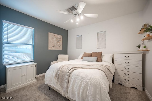 6937 Puetollano Dr, North Las Vegas, NV 89084 - bedroom featuring light colored carpet and a ceiling fan