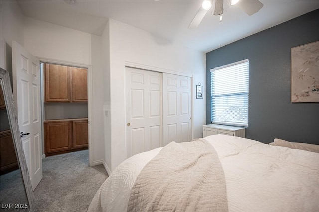 6937 Puetollano Dr, North Las Vegas, NV 89084 - bedroom with light carpet, a closet, and a ceiling fan