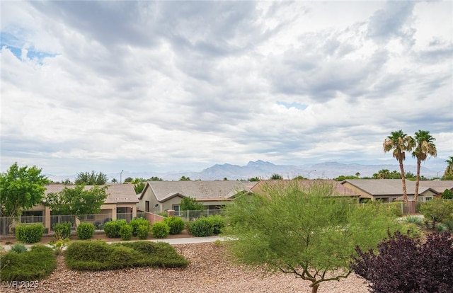 6937 Puetollano Dr, North Las Vegas, NV 89084 - view of front of home featuring a mountain view and stucco siding
