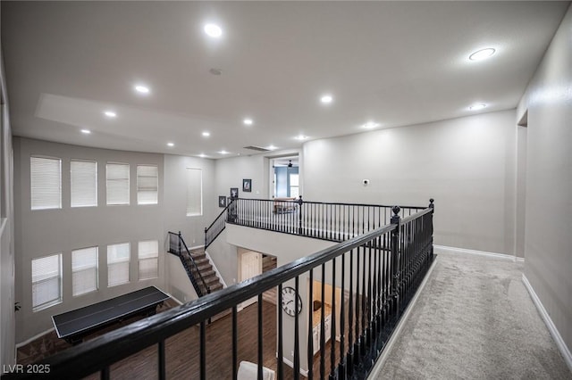 6937 Puetollano Dr, North Las Vegas, NV 89084 - hallway with an upstairs landing, recessed lighting, and carpet