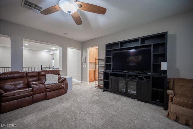 6937 Puetollano Dr, North Las Vegas, NV 89084 - living room featuring light carpet and a ceiling fan