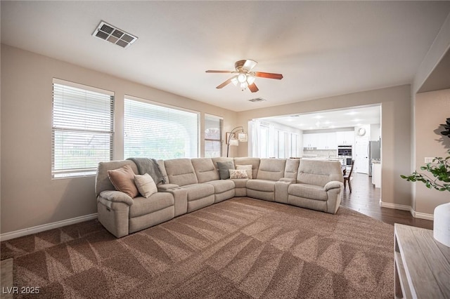 6937 Puetollano Dr, North Las Vegas, NV 89084 - living room featuring baseboards and ceiling fan