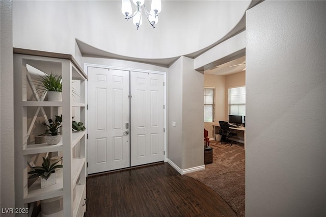 6937 Puetollano Dr, North Las Vegas, NV 89084 - foyer entrance with a chandelier and wood finished floors