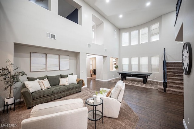 6937 Puetollano Dr, North Las Vegas, NV 89084 - living room featuring billiards, a towering ceiling, stairway, wood finished floors, and recessed lighting