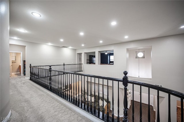 6937 Puetollano Dr, North Las Vegas, NV 89084 - hallway with recessed lighting, an upstairs landing, and carpet floors