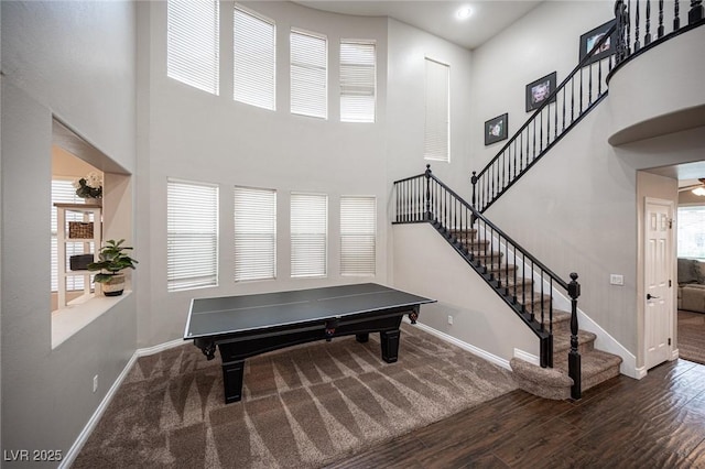 6937 Puetollano Dr, North Las Vegas, NV 89084 - game room with a high ceiling and wood finished floors