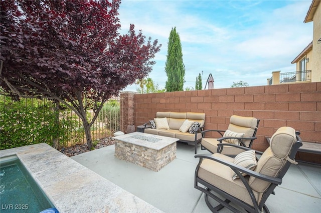 6937 Puetollano Dr, North Las Vegas, NV 89084 - view of patio / terrace featuring an outdoor living space with a fire pit
