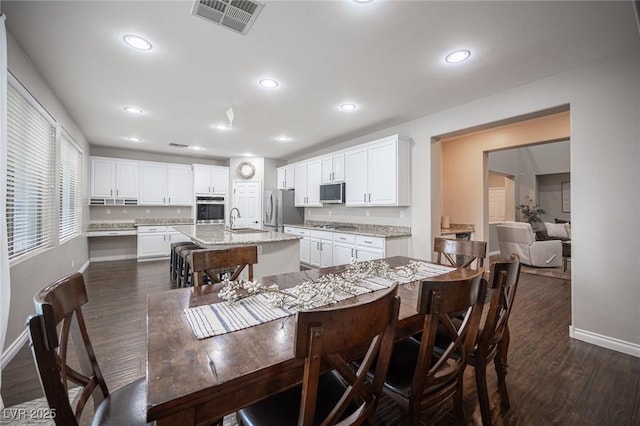 6937 Puetollano Dr, North Las Vegas, NV 89084 - dining area featuring recessed lighting and dark wood-type flooring