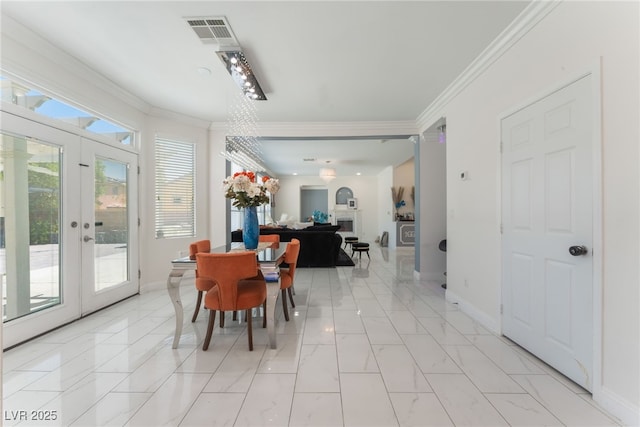 2912 Hot Cider Ave, North Las Vegas, NV 89031 - dining room featuring crown molding, light marble finish floors, and french doors
