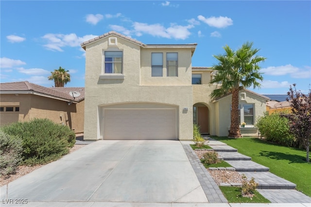 2912 Hot Cider Ave, North Las Vegas, NV 89031 - view of front facade featuring stucco siding, driveway, a garage, and a front lawn