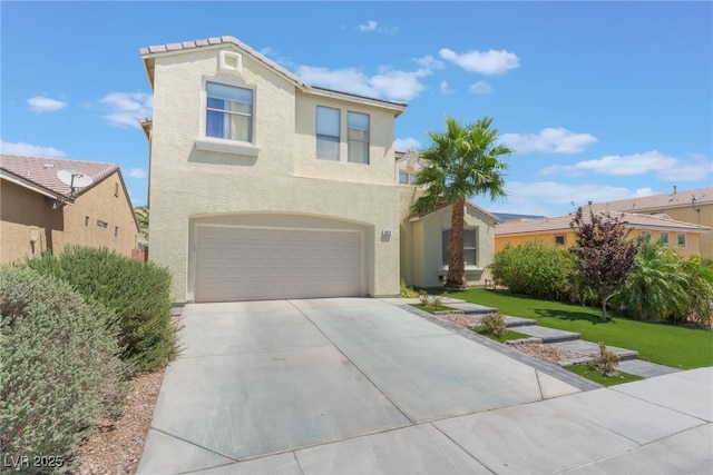 2912 Hot Cider Ave, North Las Vegas, NV 89031 - view of front facade with concrete driveway, a garage, stucco siding, and a front yard