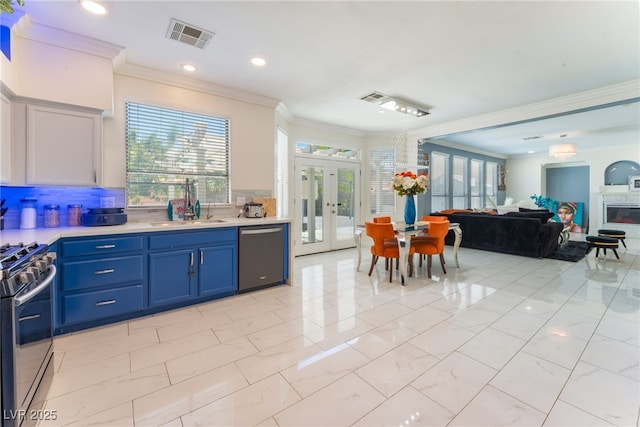 2912 Hot Cider Ave, North Las Vegas, NV 89031 - kitchen with dishwashing machine, stainless steel gas range, french doors, light countertops, and crown molding