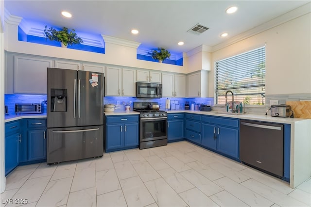 2912 Hot Cider Ave, North Las Vegas, NV 89031 - kitchen featuring appliances with stainless steel finishes, ornamental molding, light countertops, tasteful backsplash, and recessed lighting