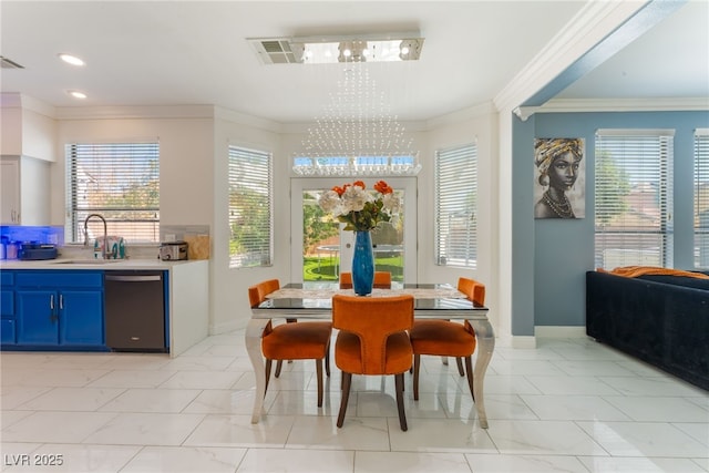 2912 Hot Cider Ave, North Las Vegas, NV 89031 - dining space featuring a chandelier, ornamental molding, and light marble finish floors